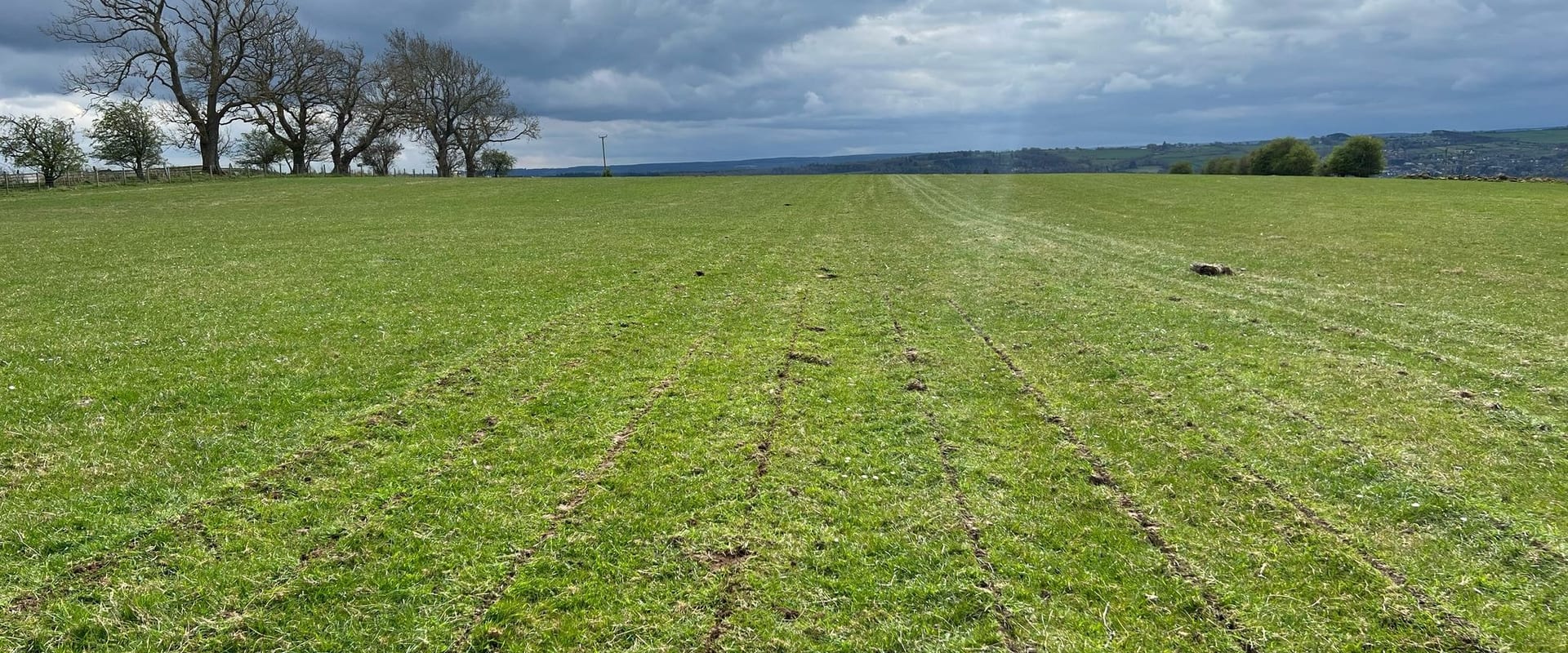 Grassland pasture field tractor working UK countryside