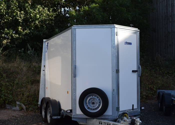 Enclosed box van trailer on the road