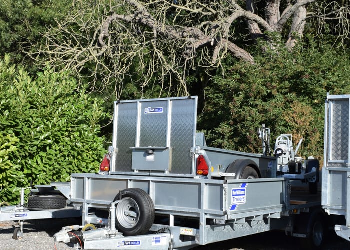 Flatbed trailer carrying farm machinery
