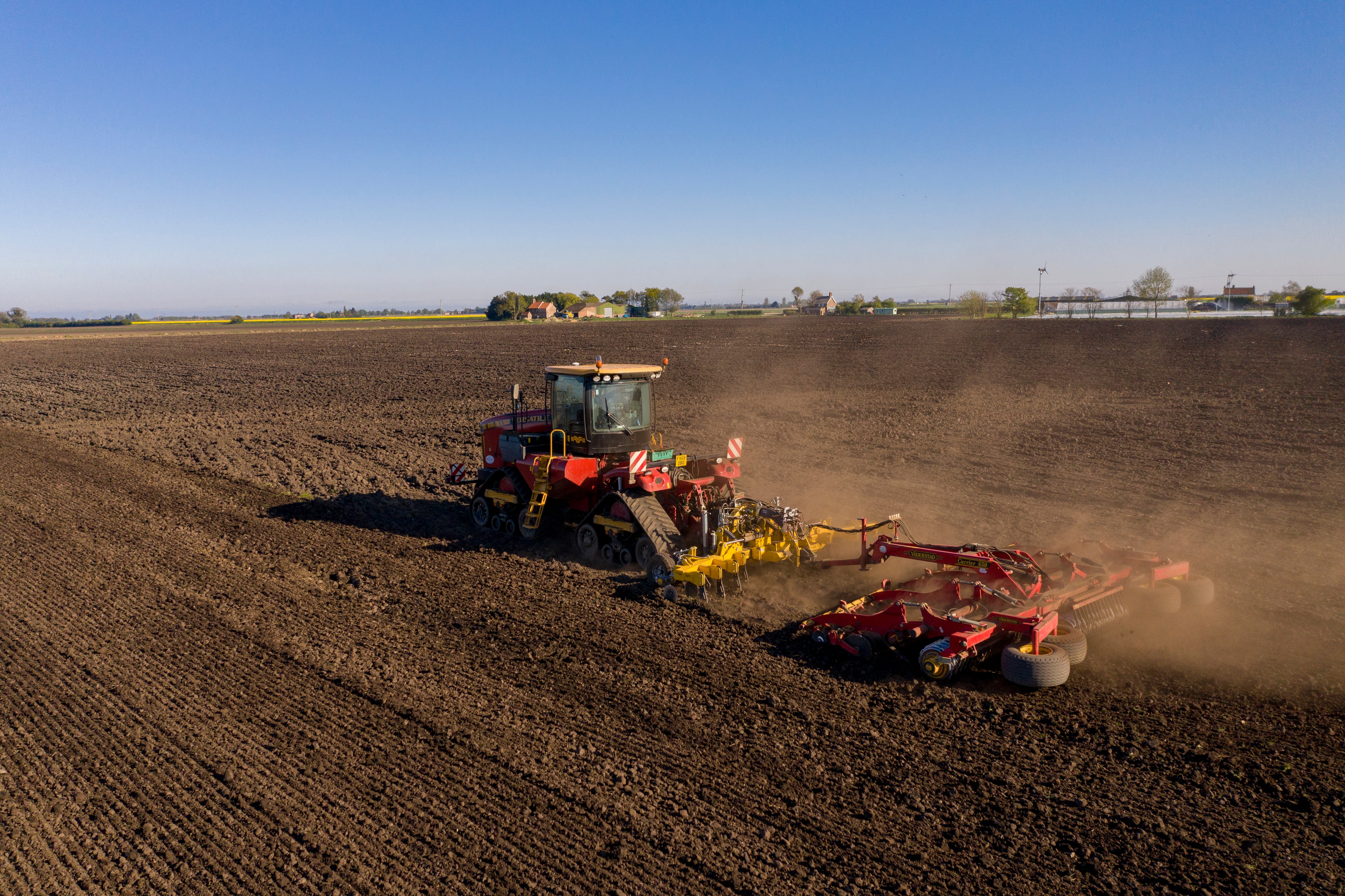 Low disturbance toolbar tractor field cultivation soil preparation
