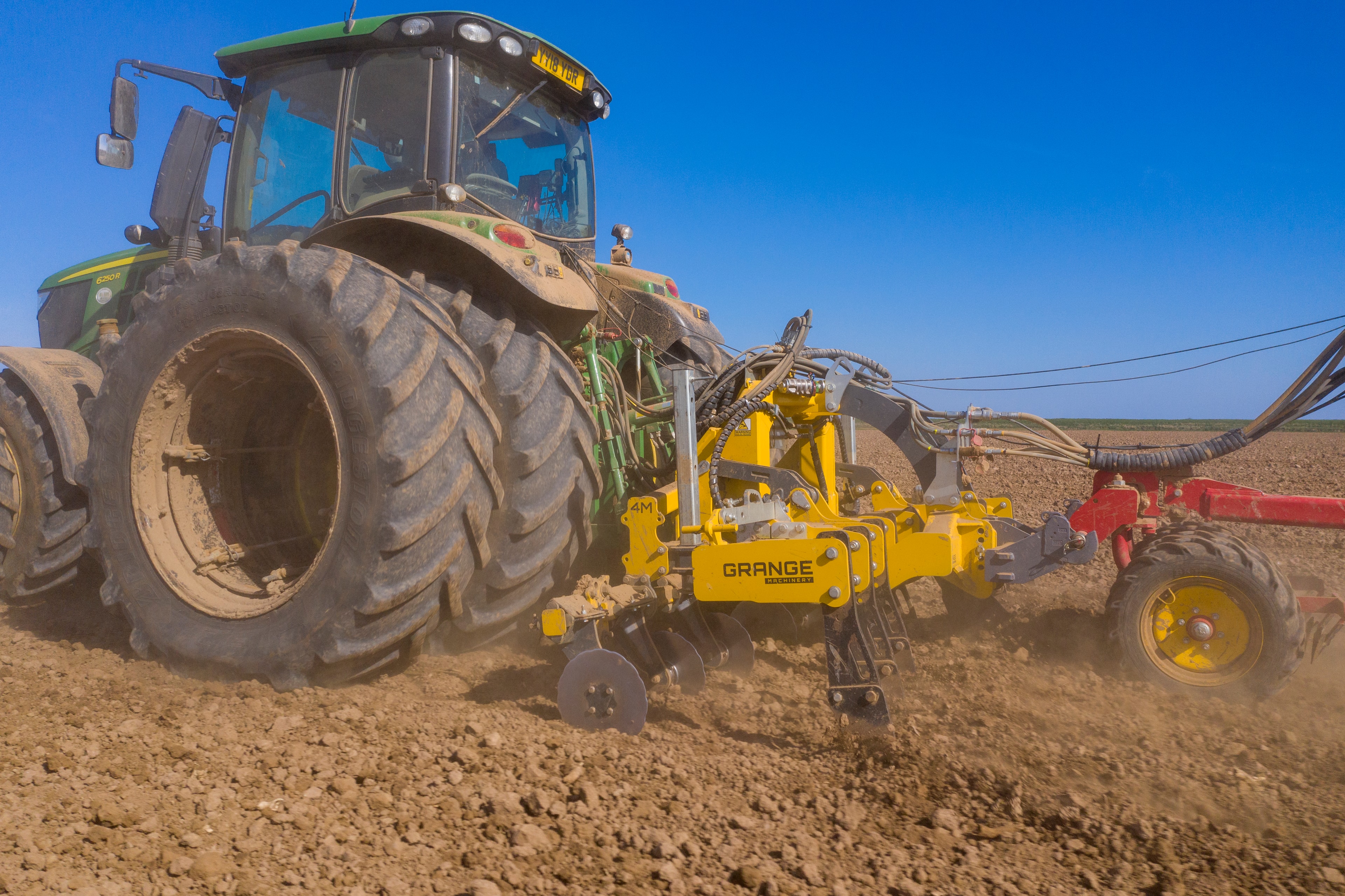 Tractor implement rear view field cultivation soil preparation