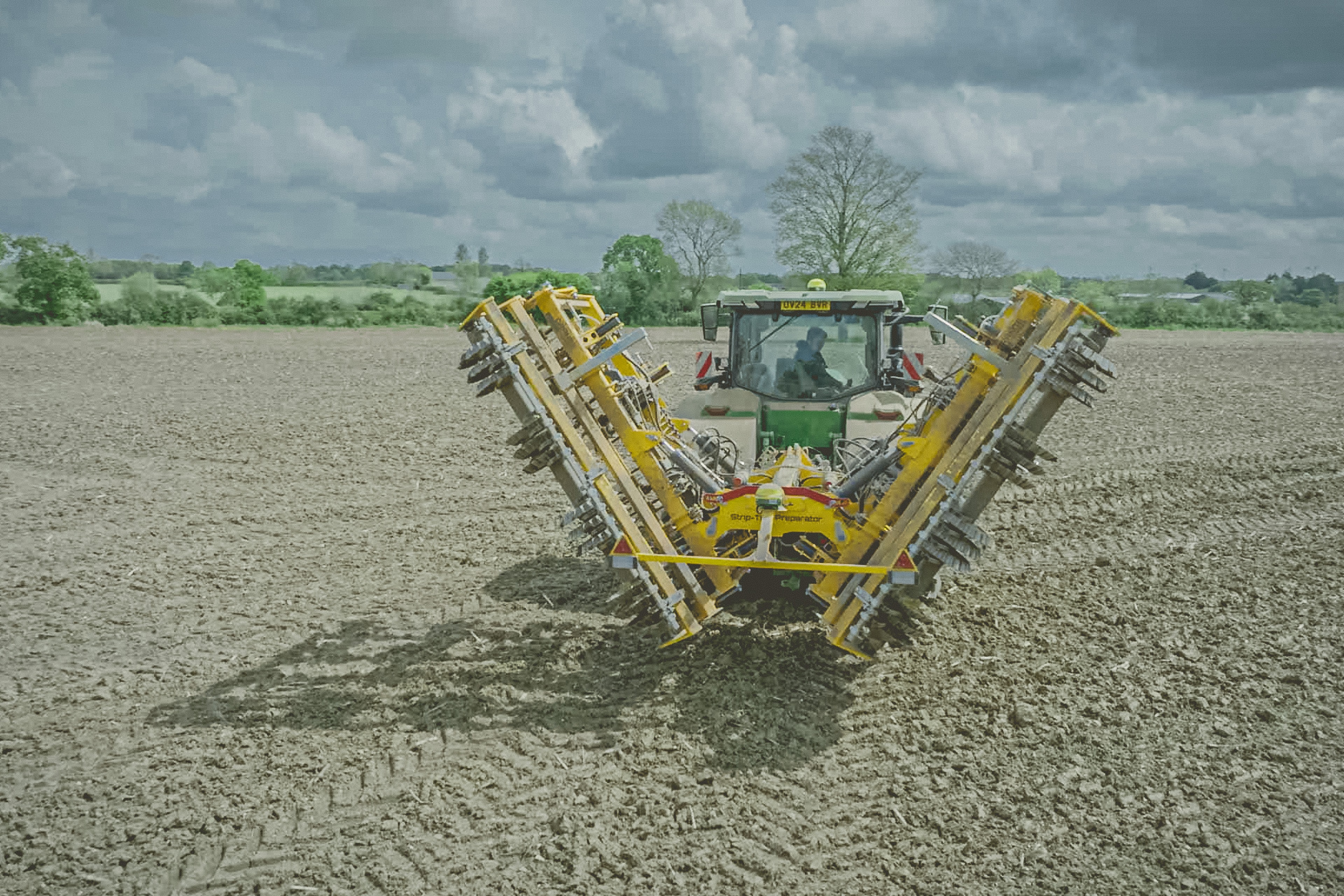 Hydraulic folding wing agricultural implement transport