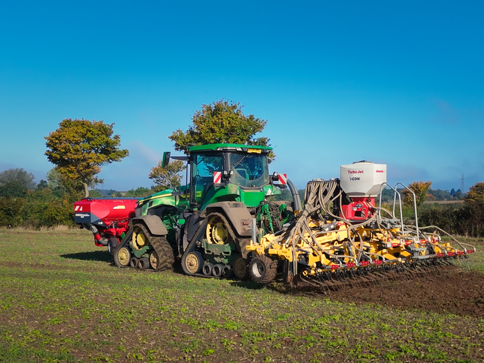 Tine Drill Toolbar working at sunset